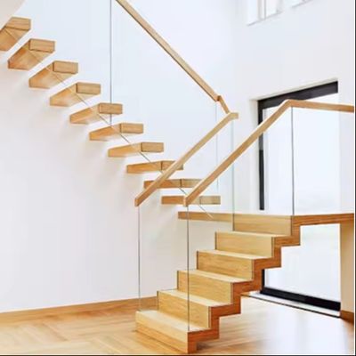 Villa de diseño de escalera flotante de acero invisible con barandilla de vidrio de tramo de madera